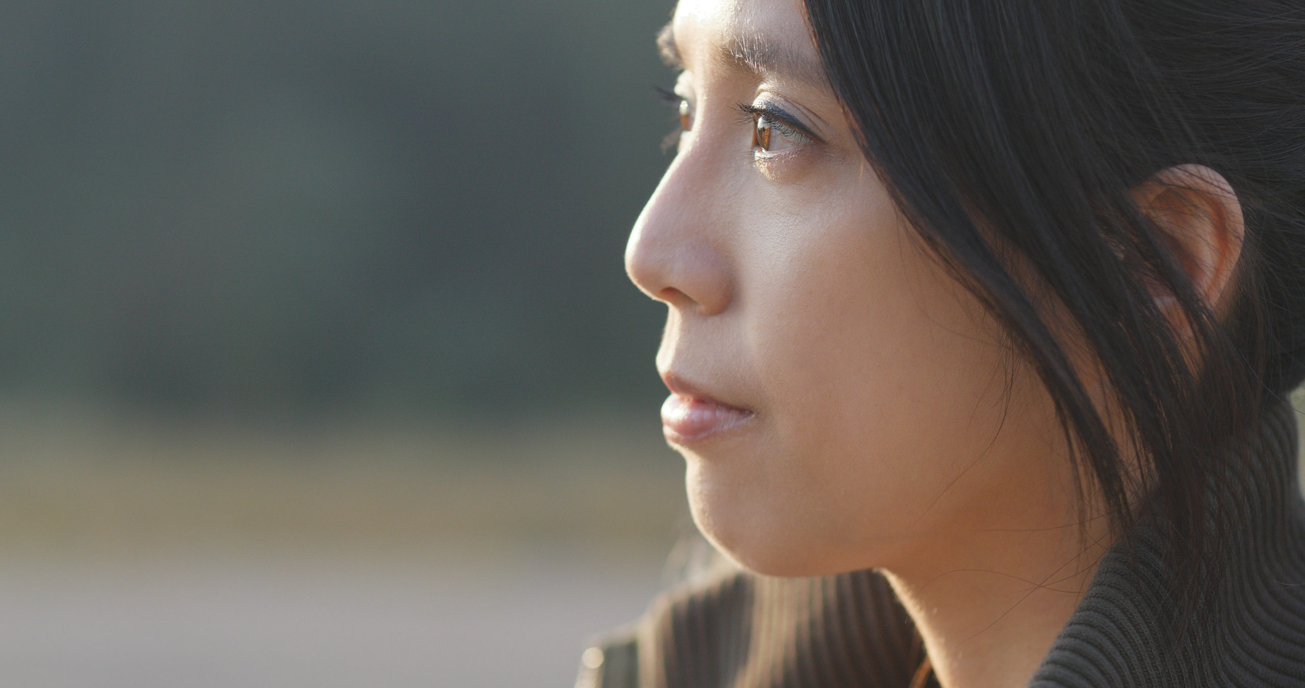 Pensive Asian woman