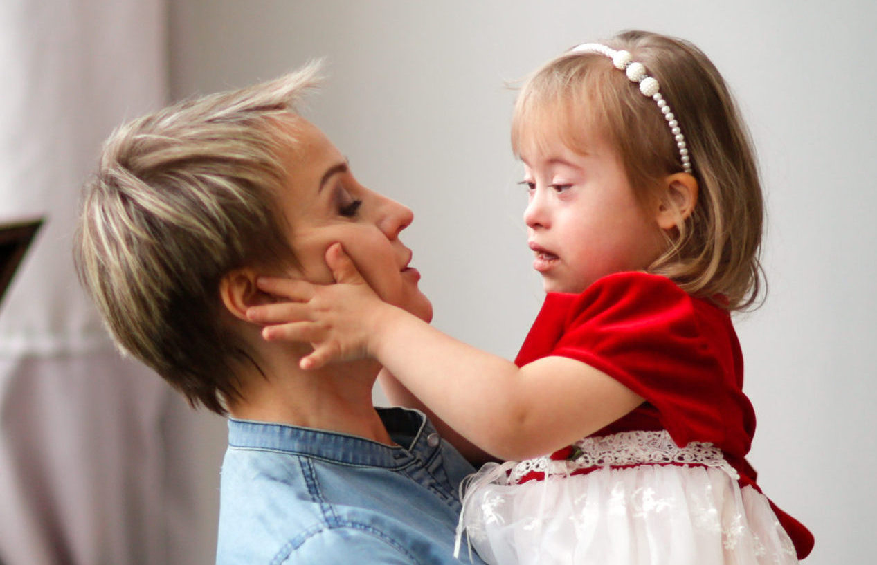 White mom and Downs daughter