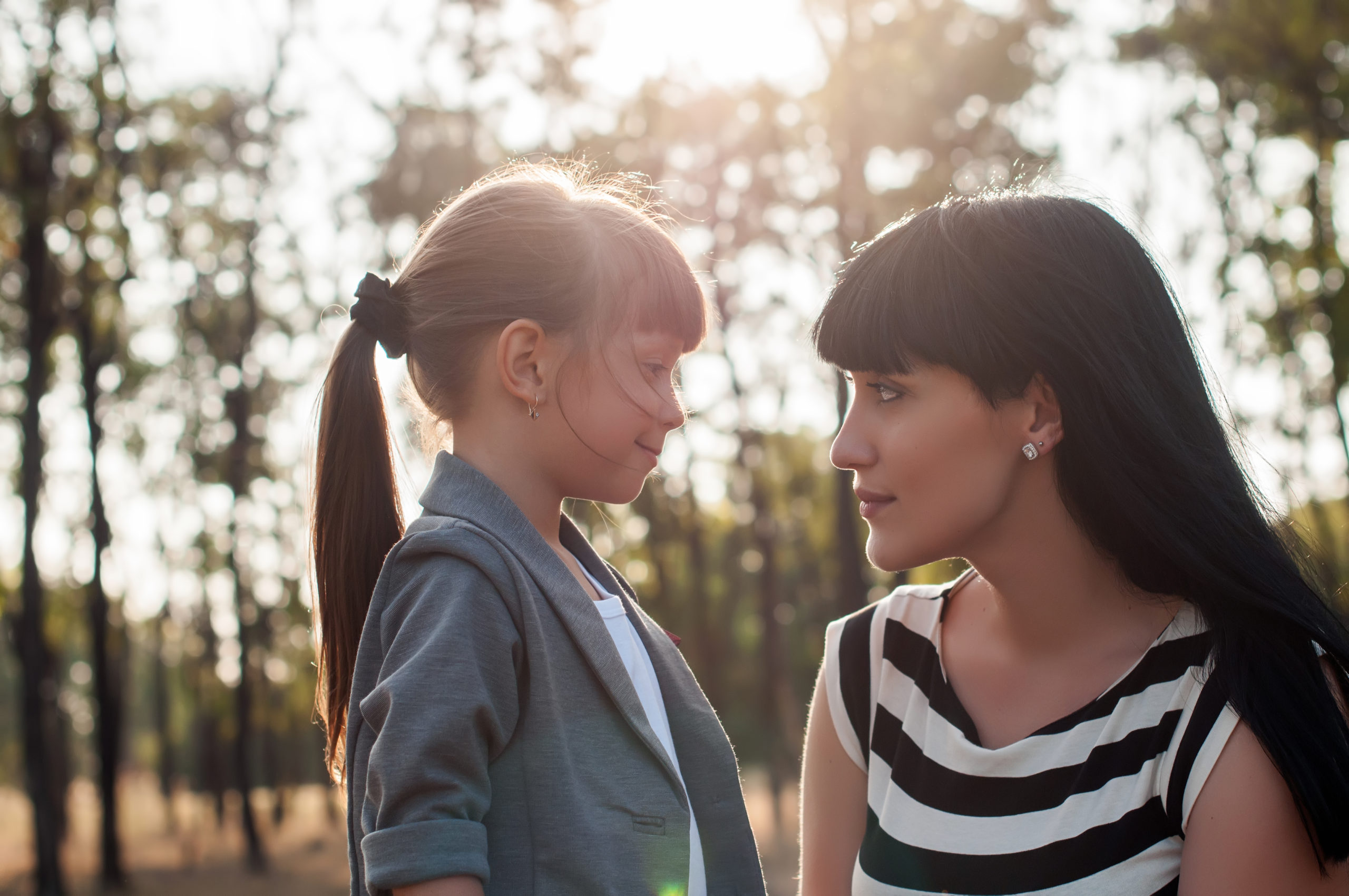 Young white mom and school aged girl